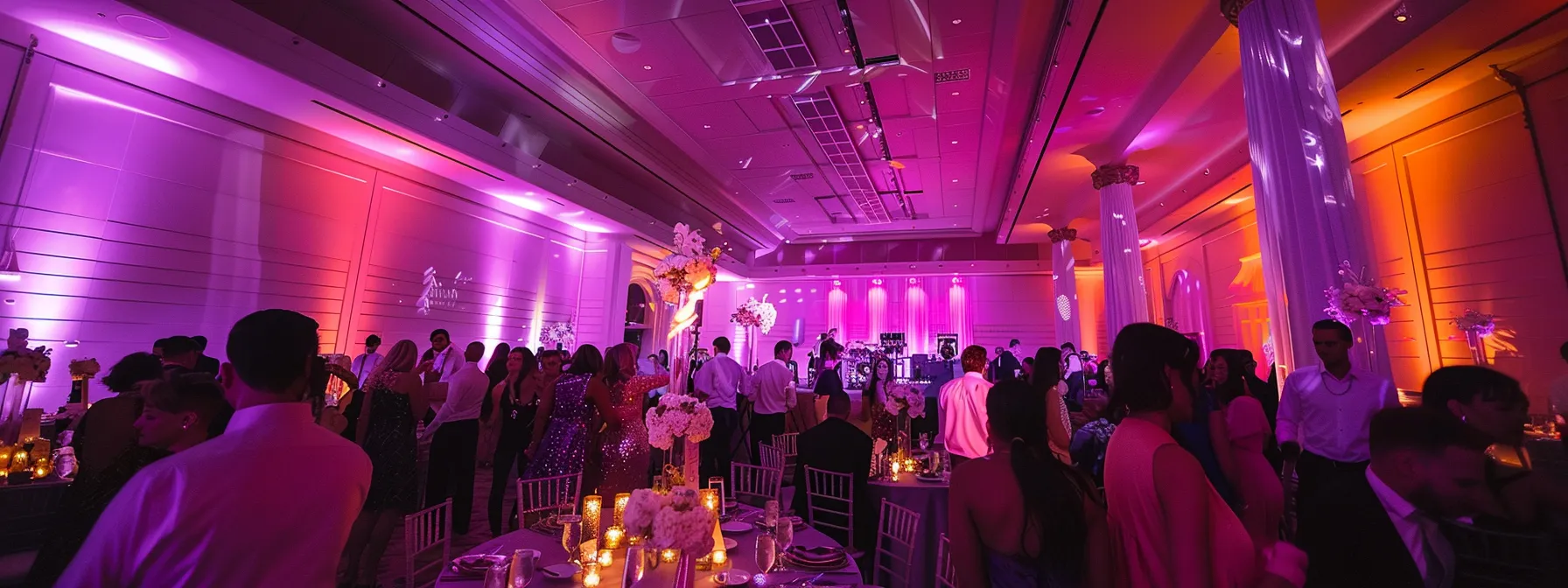 a vibrant wedding reception in toronto, illuminated by dynamic lighting, featuring a skilled dj passionately mixing an eclectic playlist, as joyful guests dance and celebrate in a festive atmosphere.