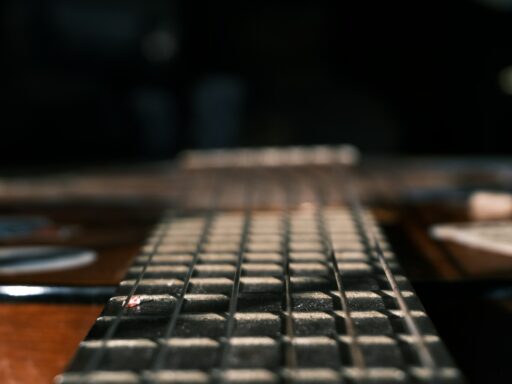 Close-up of a guitar fretboard and strings