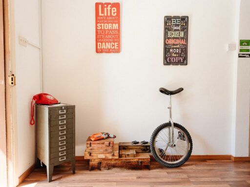 A unicycle leaning against a wall