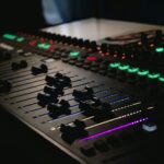 DJ mixing console with glowing controls, ready for an event