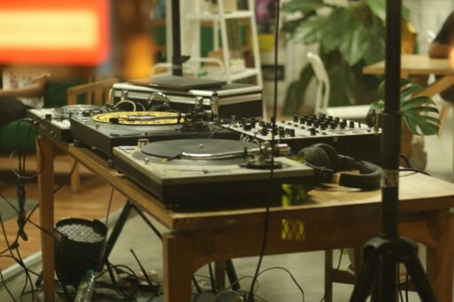 A DJ turntable and mixer setup on a table