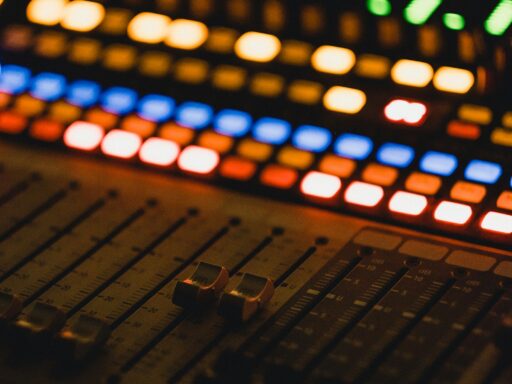 A close-up of an audio mixer