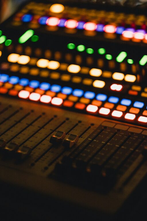 A close-up of an audio mixer