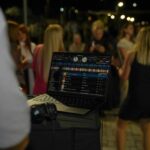 DJ mixing music at a wedding reception