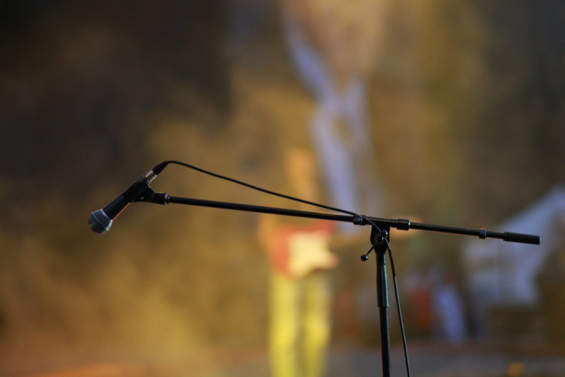 A microphone on stage, ready for a comedy set