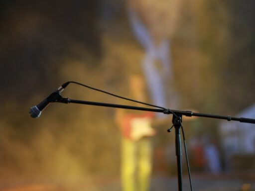A microphone on stage, ready for a comedy set